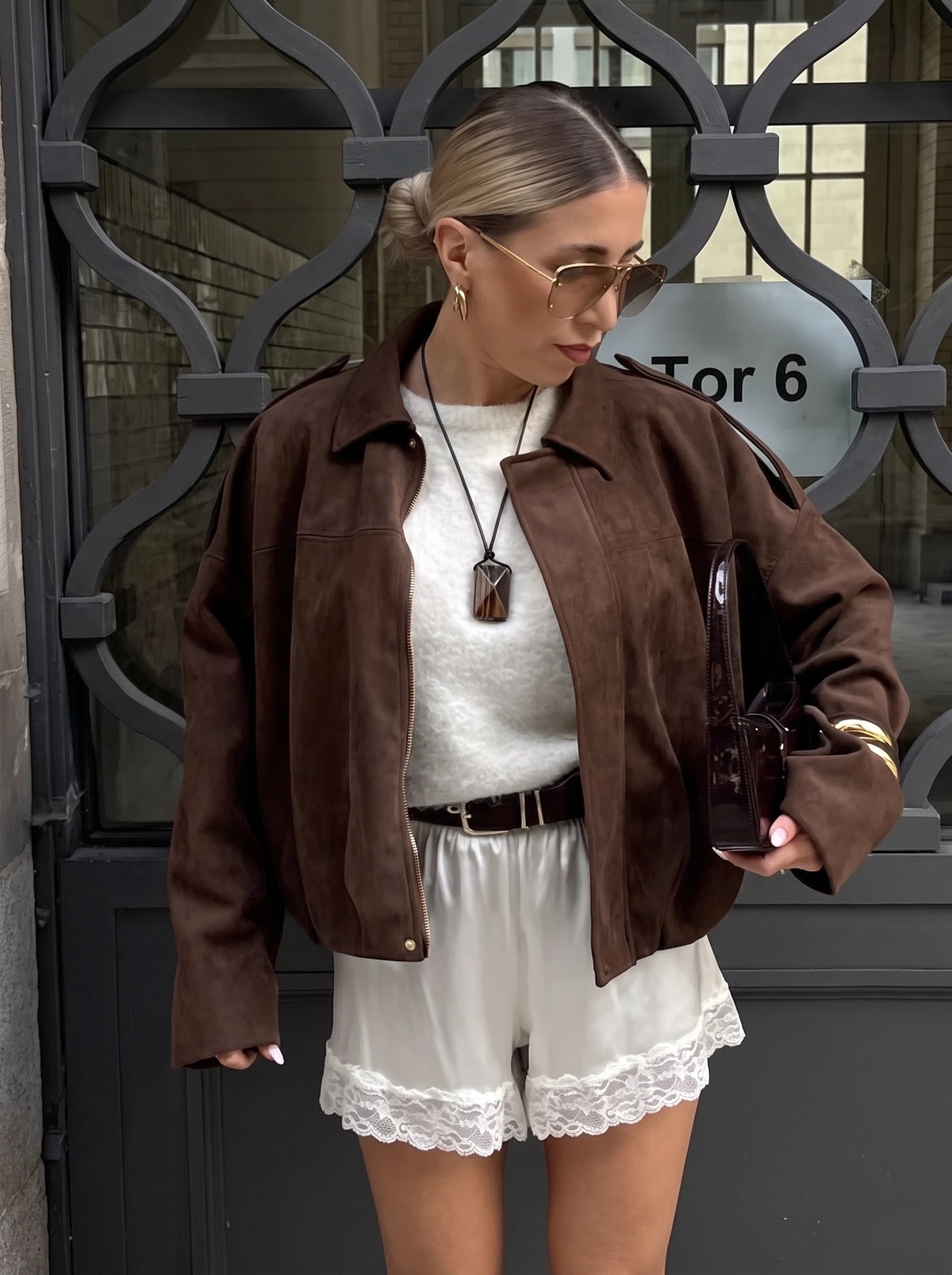 The Cropped Bomber — Dark brown, open-front model view