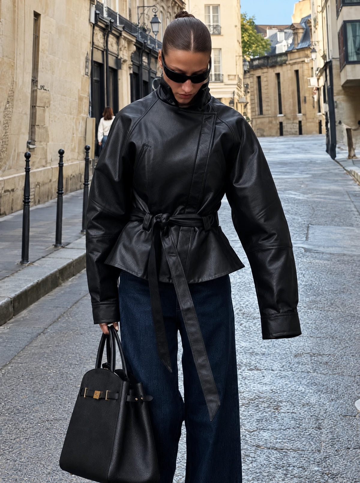 The Belted Faux-Leather Jacket — product photograph